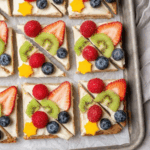 Rainbow Fruit Pizza – Lightened-Up Sugar Cookie Crust with Cream Cheese Frosting & Fresh Fruit